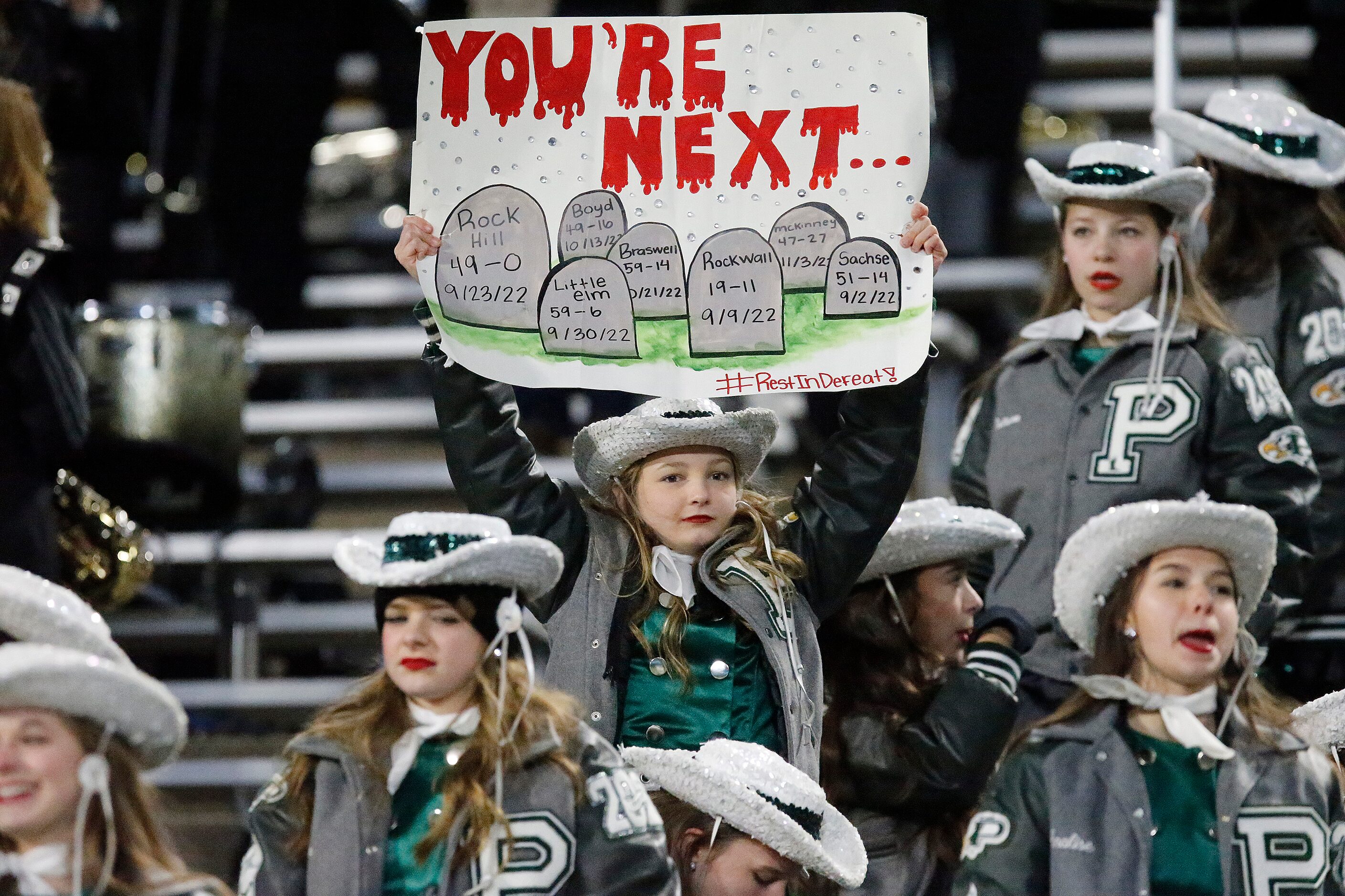 The Prosper High School drill team had a message ready during the second half as Prosper...