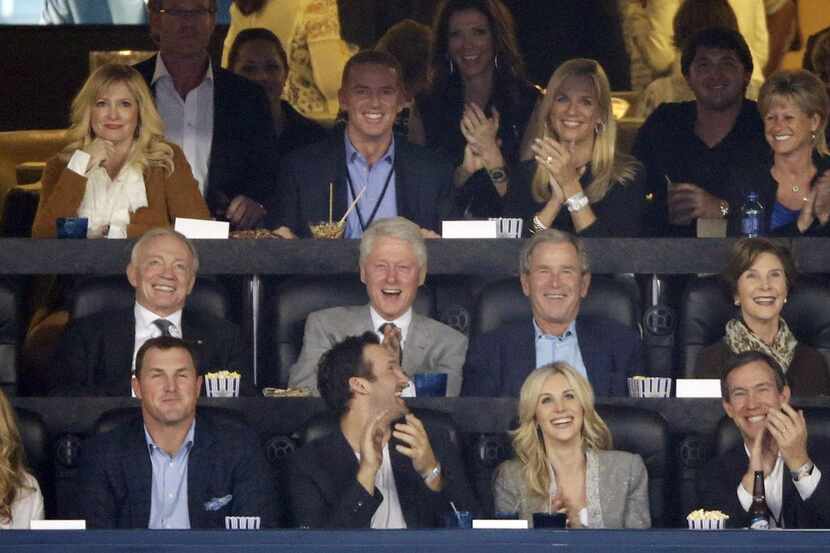 From center left, Dallas Cowboys owner Jerry Jones, former presidents Bill Clinton and...
