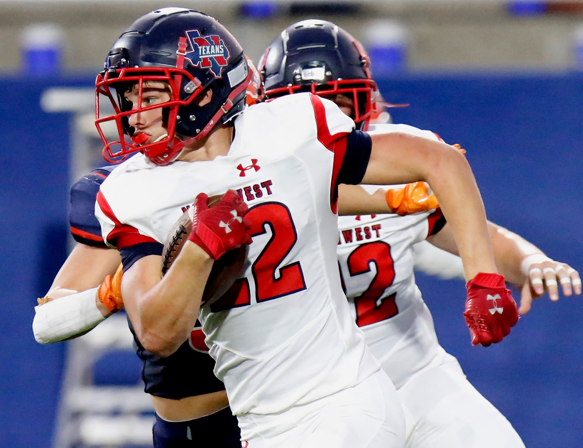 Northwest High School running back Kyle Cummings (22) carries the ball for a gain during the...