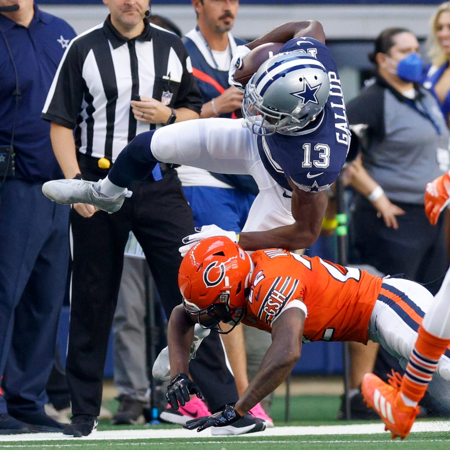 Chicago Bears cornerback Kindle Vildor (22) tackles Dallas Cowboys wide receiver Michael...