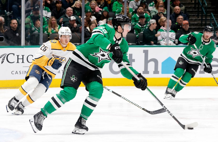 Dallas Stars defenseman Thomas Harley (55) turns the puck back up ice against Nashville...