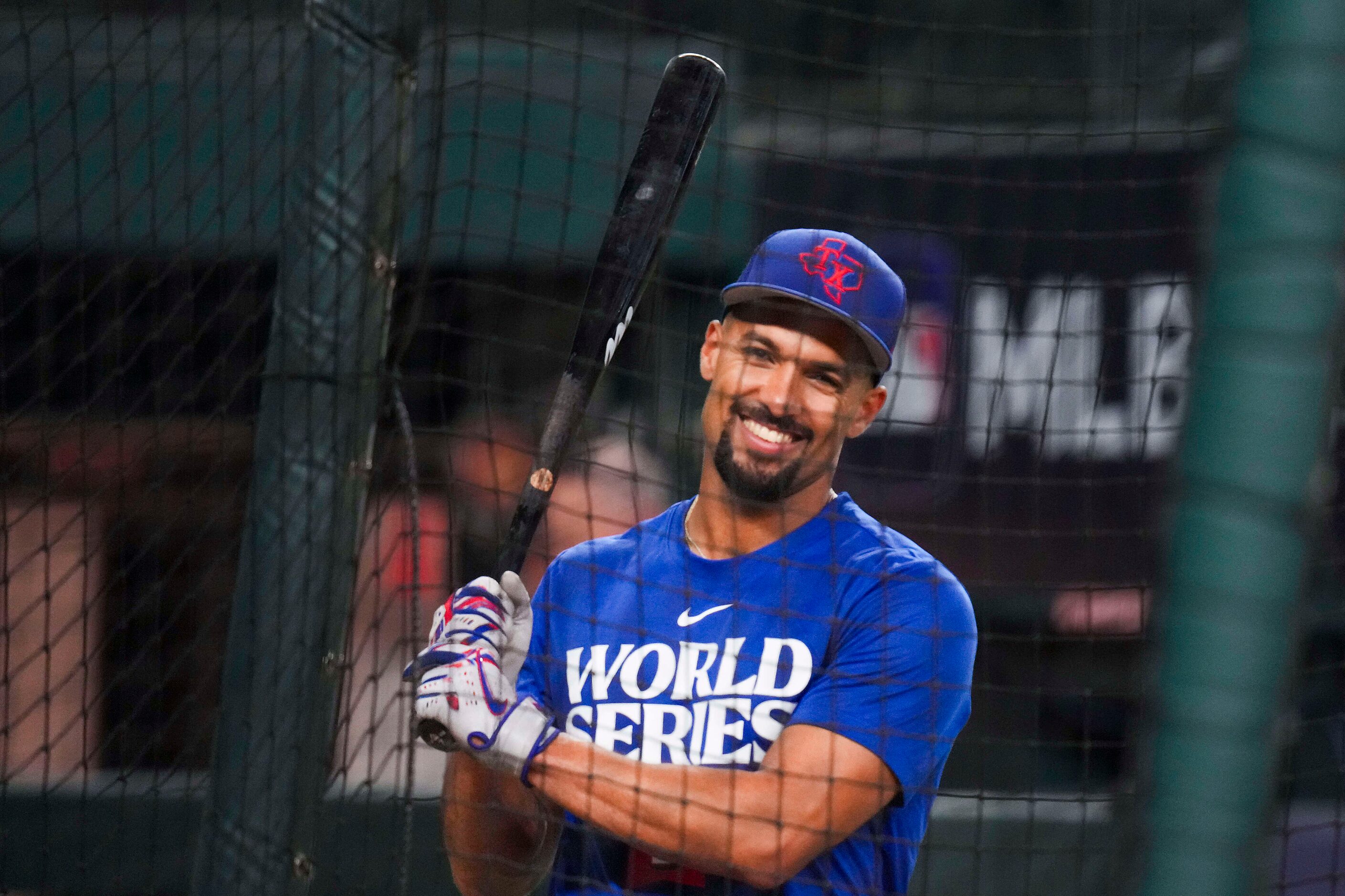 Texas Rangers second baseman Marcus Semien takes batting practice during a team workout at...