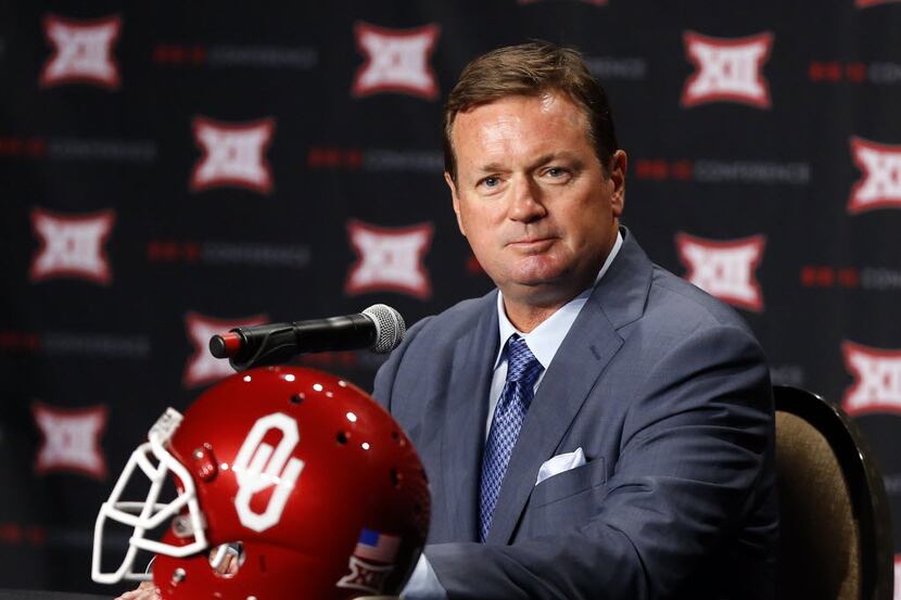 Oklahoma head football coach Bob Stoops listens to a question posed by a reporter during the...