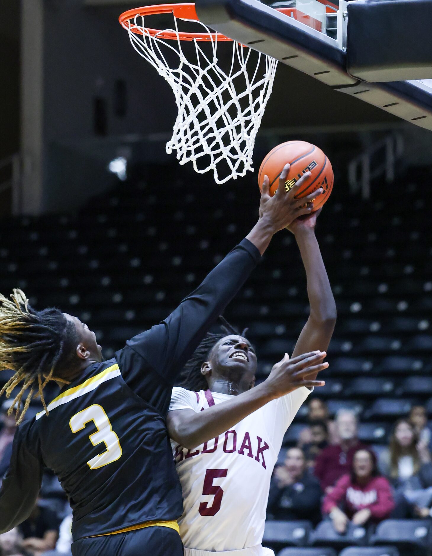 Forney senior guard Jaden Jefferson (3) places a hand on the ball to knock it down from Red...