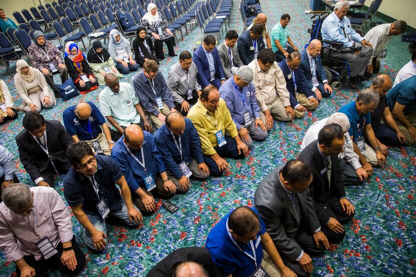 Members of the Muslim caucus pray during the Texas Democratic Convention on Friday, June 22,...