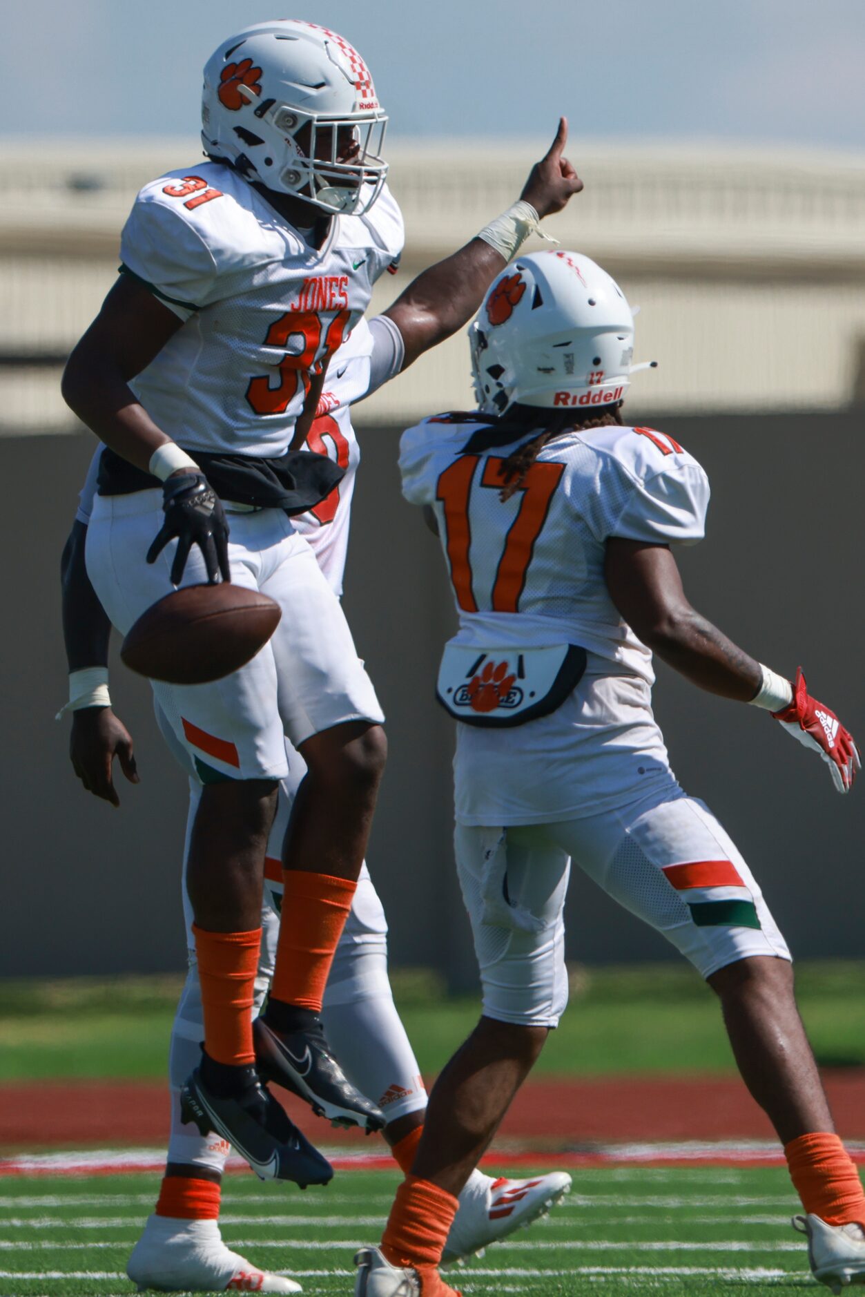 Jones High School Cory Andrews (31) jumps up in the air after picking up a fumble from...