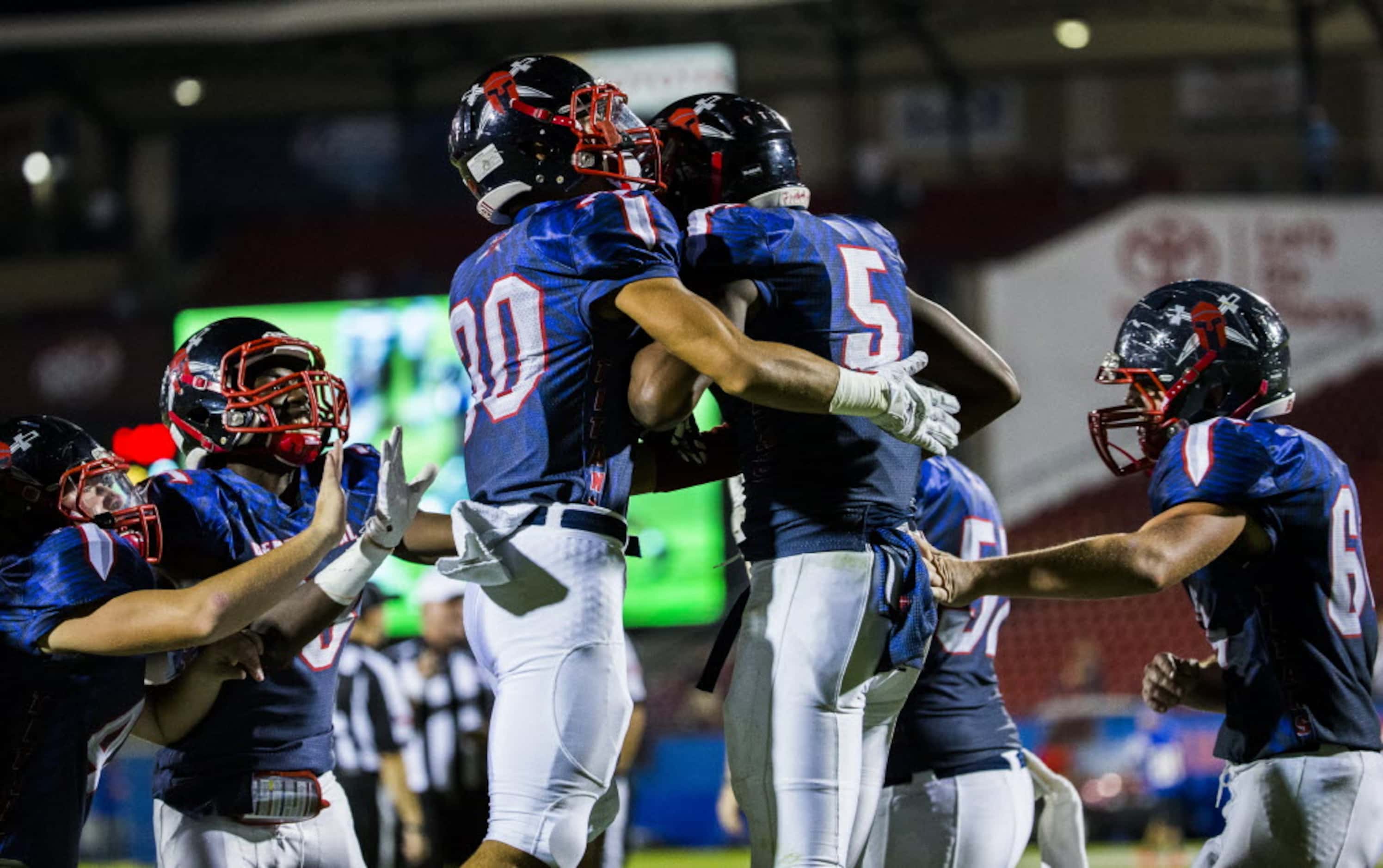 Frisco Centennial wide receiver Kenny Nelson (5) celebrates with defensive back Eric...