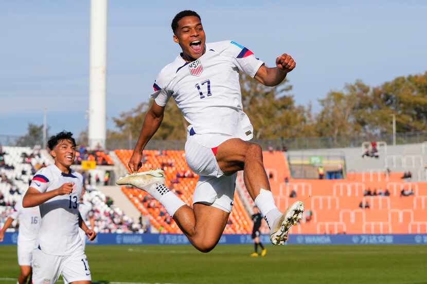 Justin Che of the United States celebrates scoring his side's 3rd goal against New Zealand...