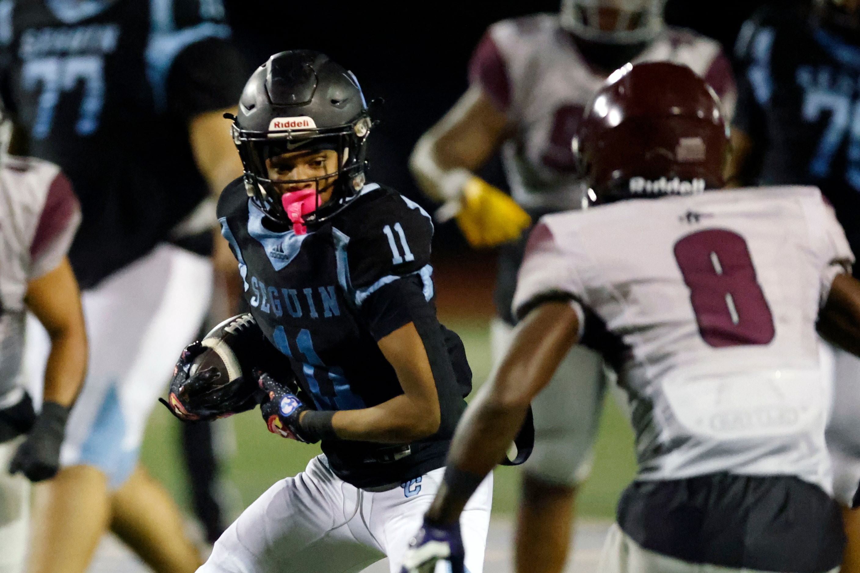 Arlington Seguin wide receiver Carterrious Brown (11) runs after a catch as he’s pursued by...