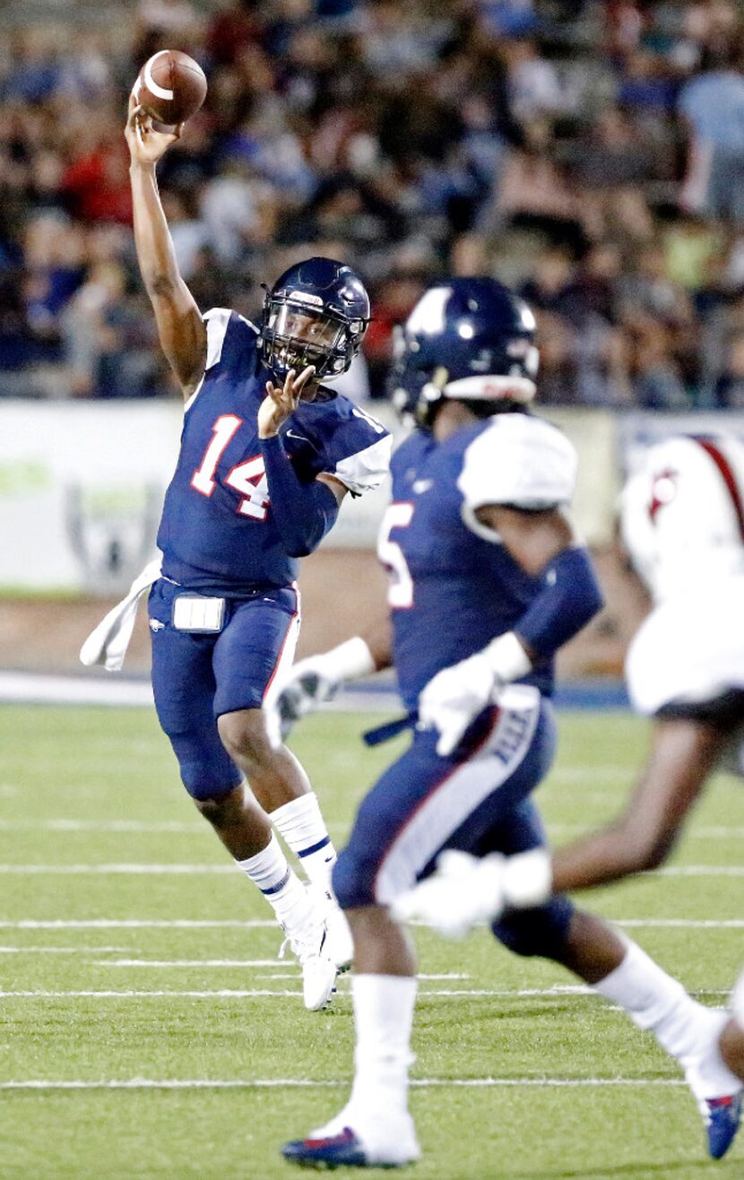 Allen quarterback Grant Tisdale (14) looks for running back Brock Sturges (5) during the...