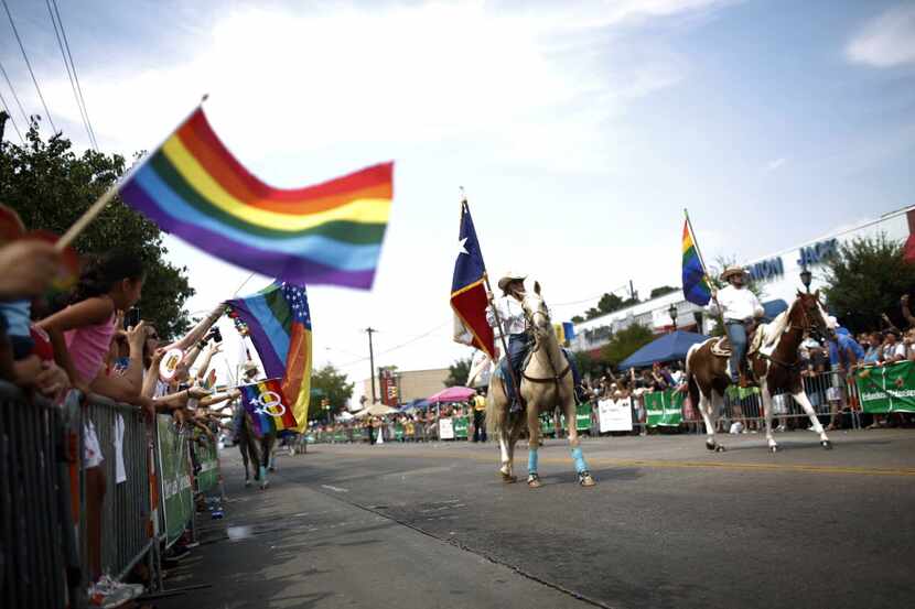 The Texas Gay Rodeo Association marches during the 30th annual Dallas Gay Pride Parade,...