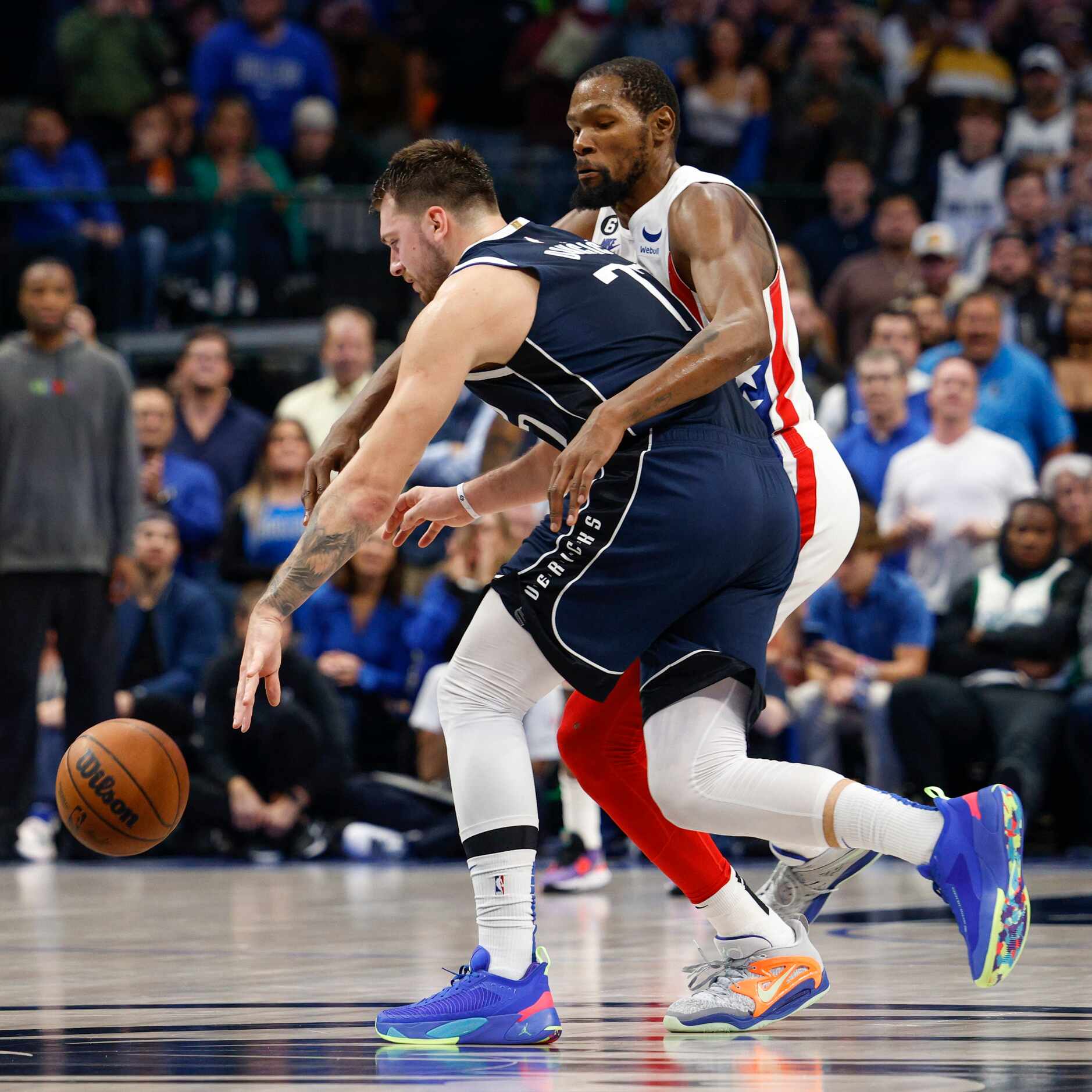 Brooklyn Nets forward Kevin Durant (7) fouls Dallas Mavericks guard Luka Doncic (77) during...