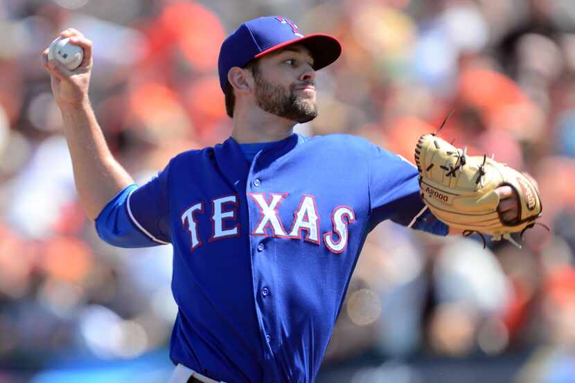 Texas Rangers starting pitcher Nick Martinez (22) pitches against the San Francisco Giants...