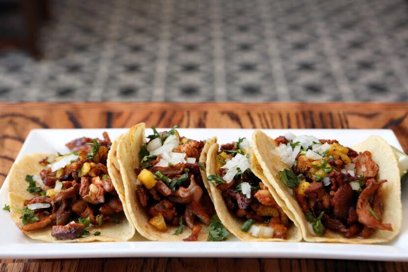 El Bolero's tacos al pastor includes shaved pork, cilantro, onion and salsa picante....