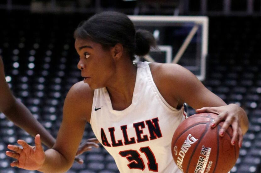 Allen guard Nyah Green (31) drives to the basket during second half action against Sachse....