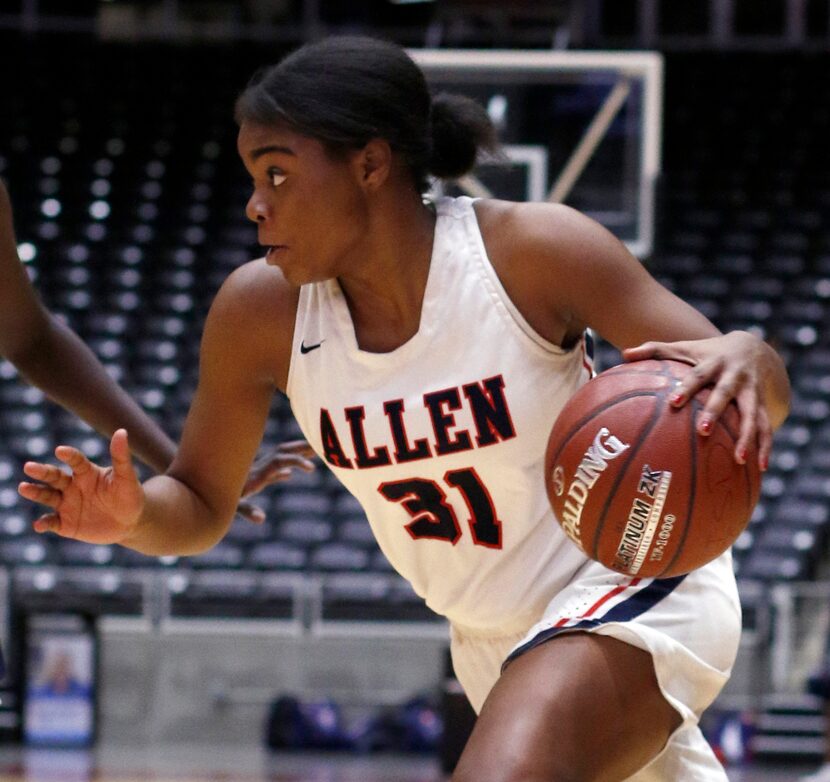 Allen guard Nyah Green (31) drives to the basket during second half action against Sachse....