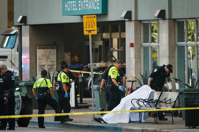DART and Dallas police investigate the scene of a shooting in downtown Dallas on Friday. ...