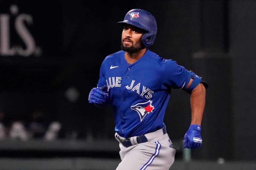 Toronto Blue Jays' Marcus Semien homers against the Minnesota Twins in a baseball game,...