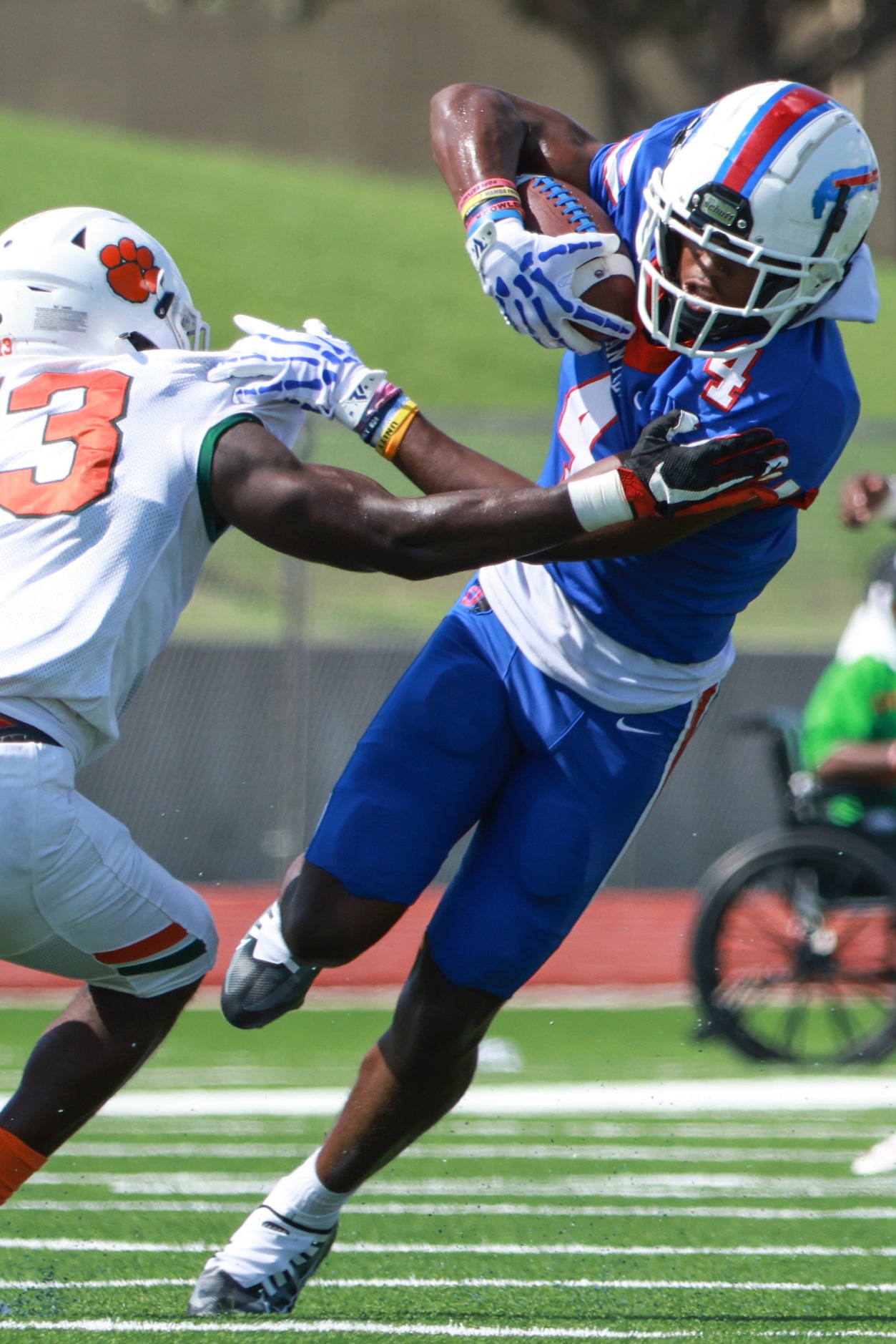 Duncanville High School Dakorian Moore (4) runs the ball up the field as Jones High School...