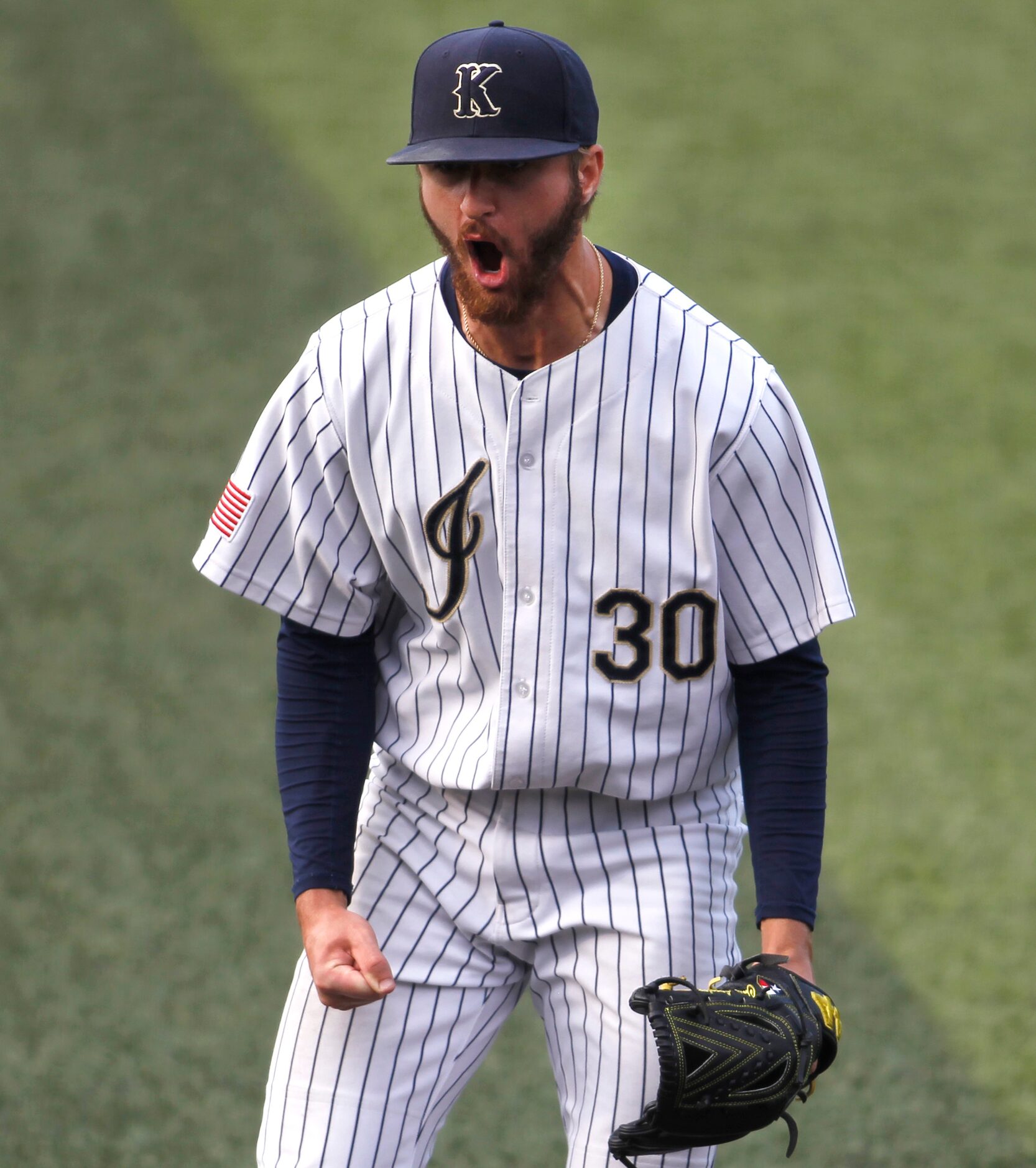 Keller pitcher Chris Langley (30) lets out a yell after retiring the final Flower Mound...