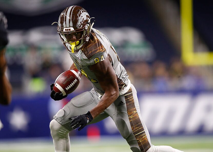 DETROIT, MI - DECEMBER 02: Corey Davis #84 of the Western Michigan Broncos looks for yards...