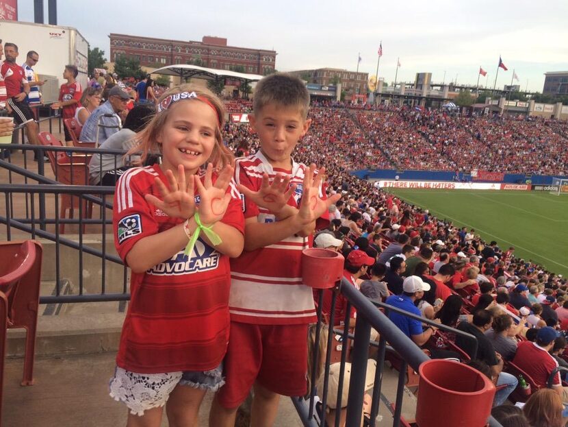 Sol Salamone and Reagan Sterling out enjoying a game with their dads