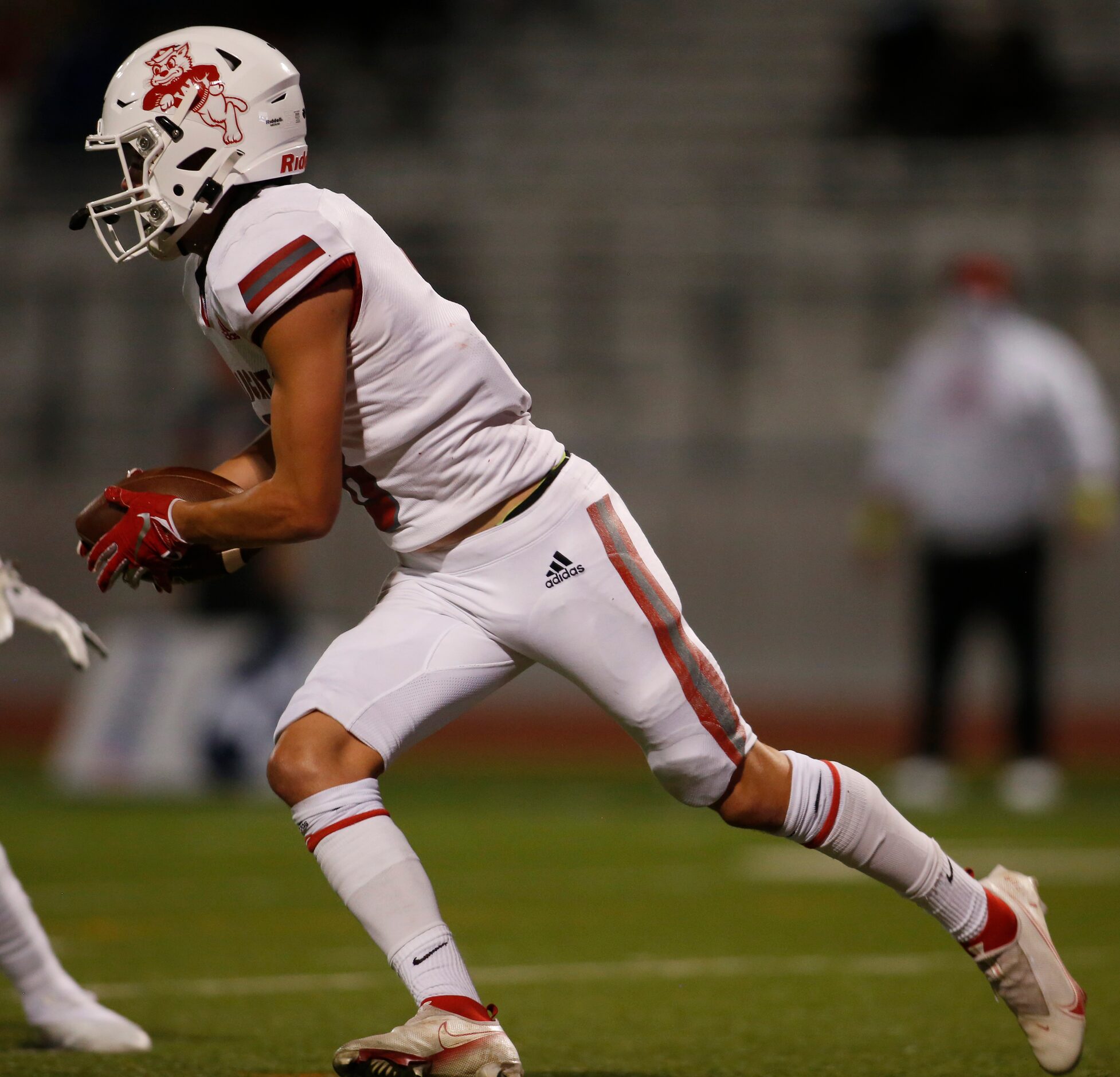 Dallas Woodrow Wilson punter Benjamin Smith (8) looks for running room as he tries to look...