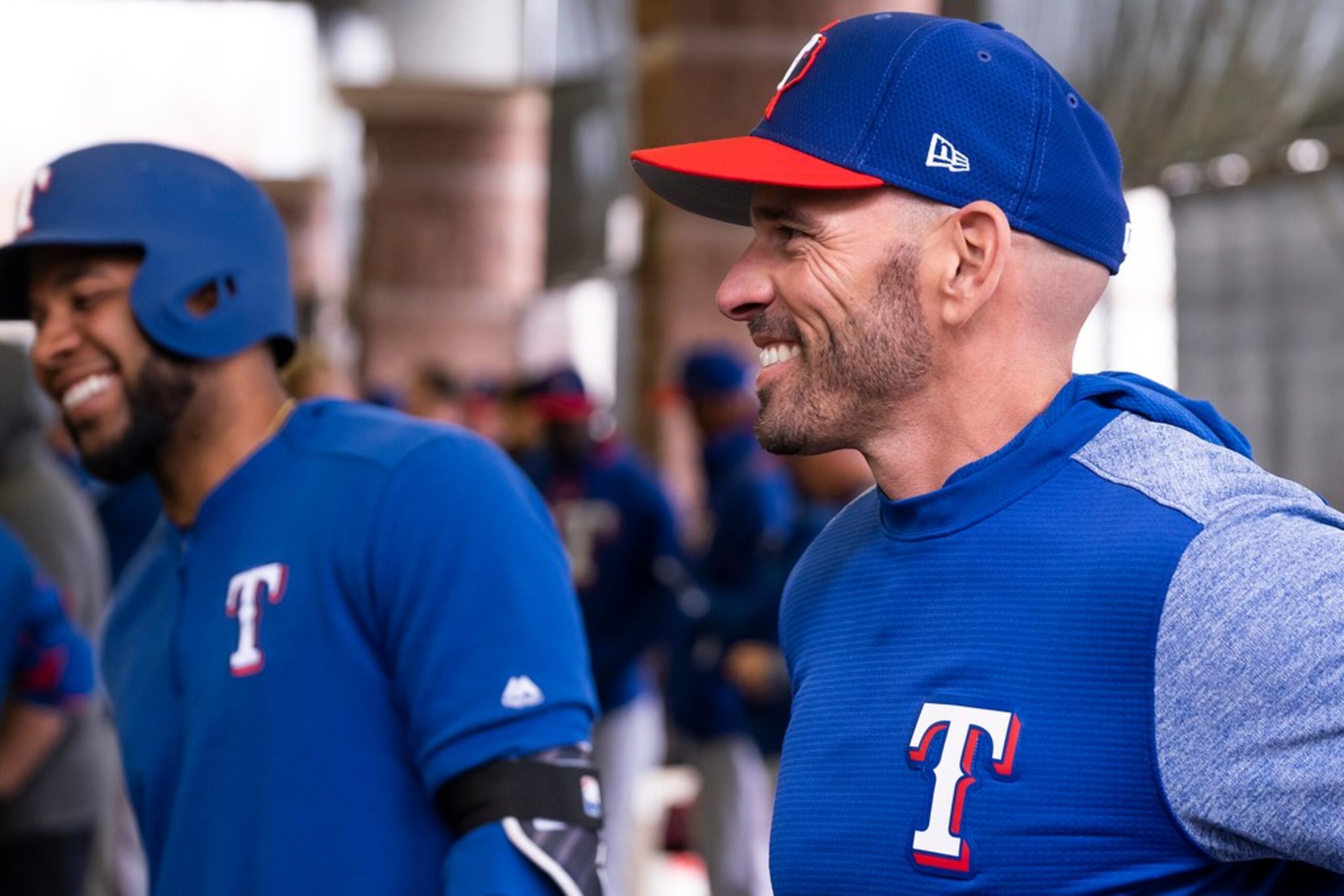 Texas Rangers manager Chris Woodward and shortstop Elvis Andrus watch batting practice...