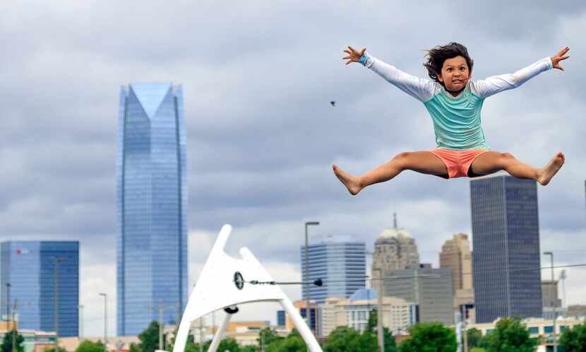 Sienna Fryhover, 7, gives it her all as she has fun in the adventure zone at Riversport...