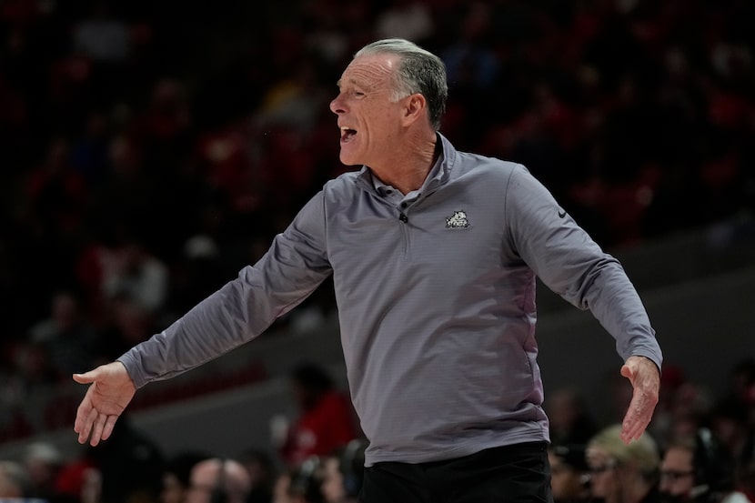 TCU head coach Jamie Dixon yells from the sideline during the first half of an NCAA college...