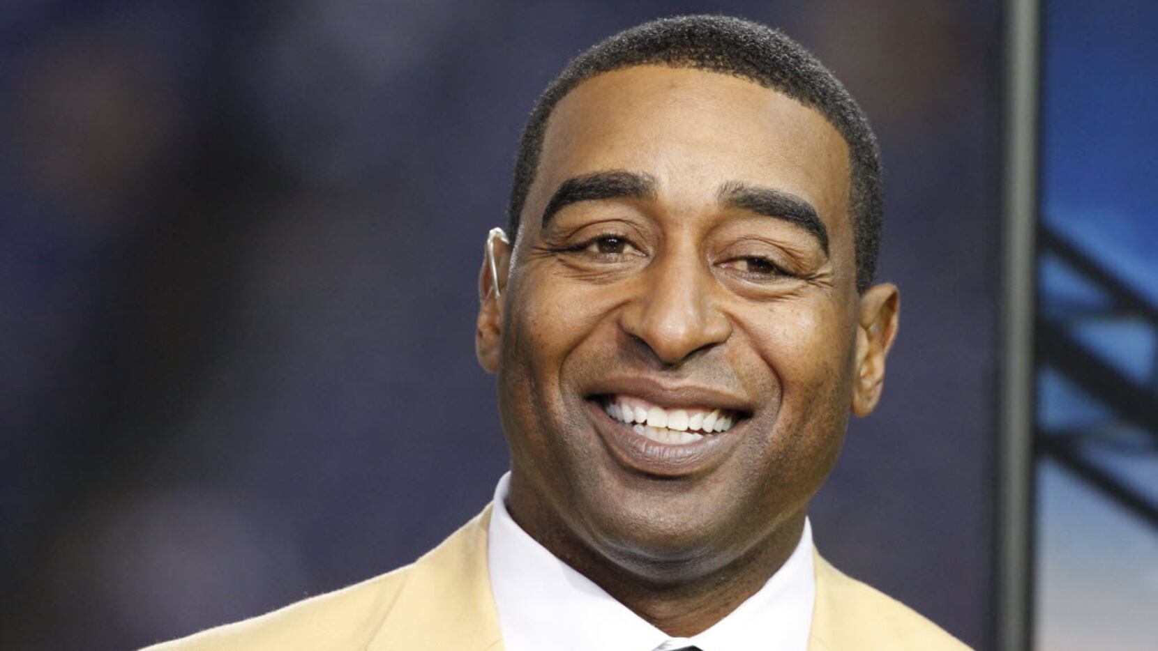FILE - This is a Nov. 7, 2013, file photo showing Cris Carter smiling in the NFL booth...