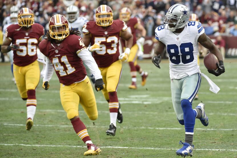 Dallas Cowboys wide receiver Dez Bryant (88) runs his first touchdown as he is chased by...