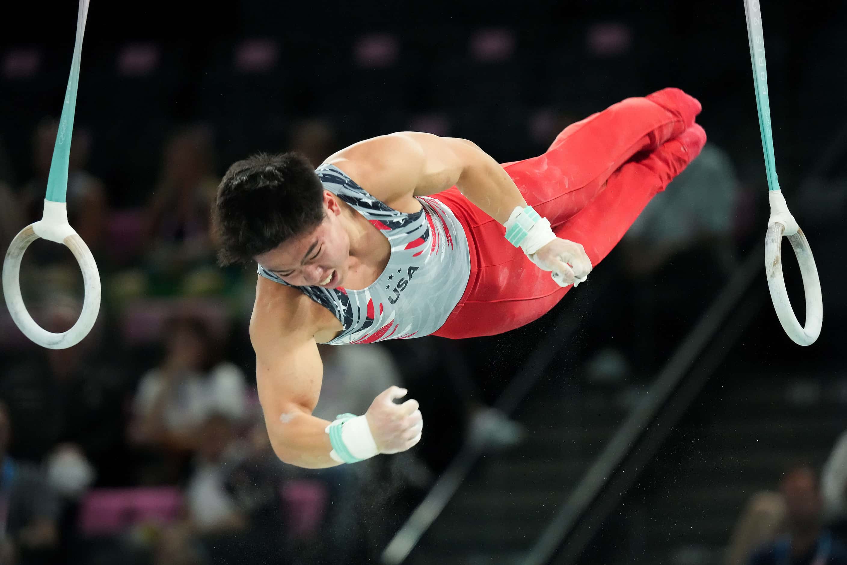 Asher Hong of the United States competes on the rings during the men’s gymnastics team final...