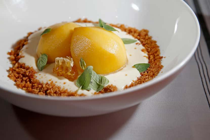 Peaches and Cream dessert at Kitchen LTO, made with bourbon-soaked Cooper Farms peaches,...