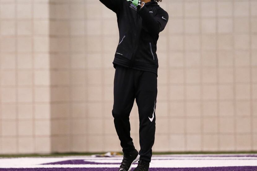 TCU's Kolby Listenbee tosses the ball during Pro Day at TCU in Fort Worth on Thursday, March...