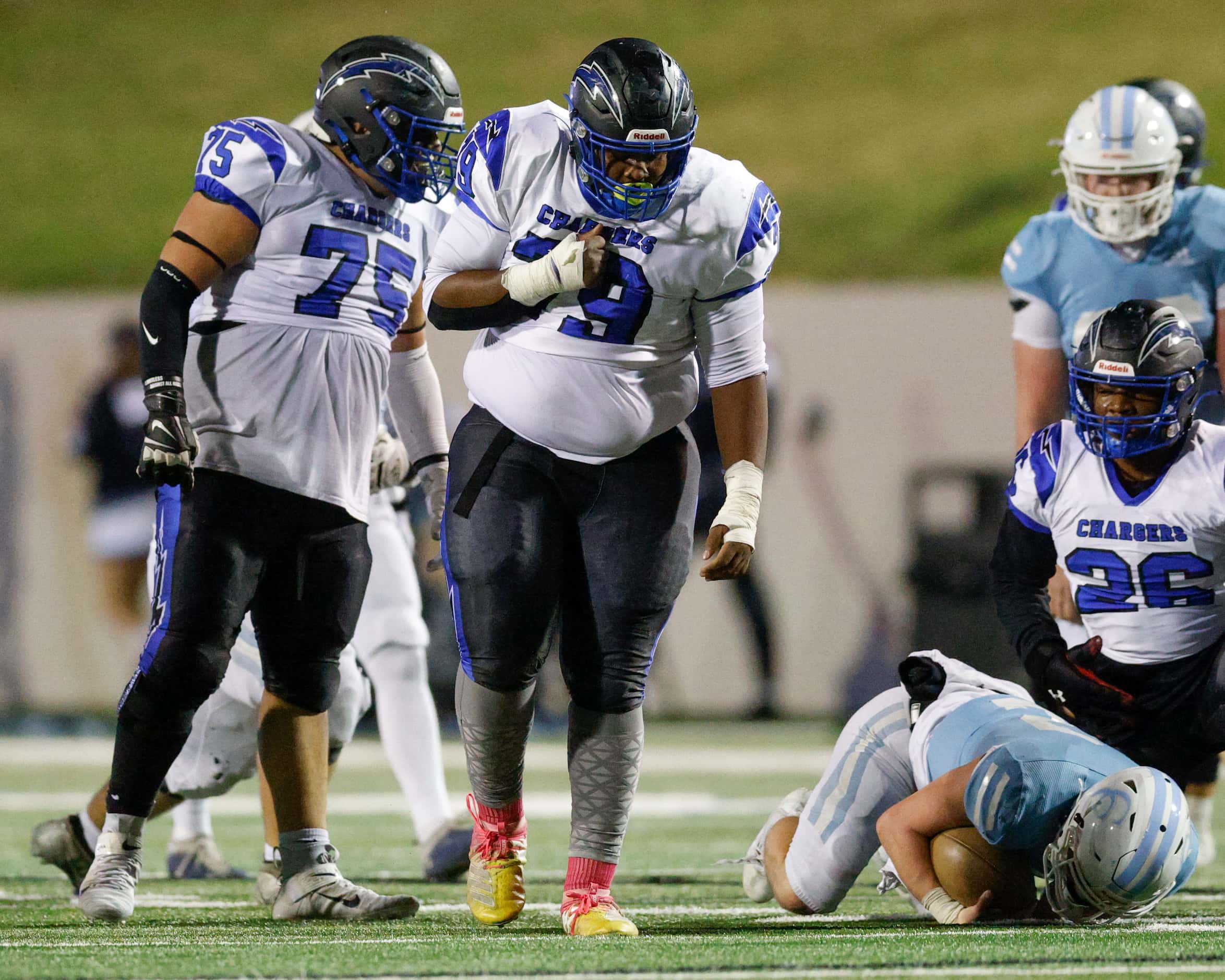 Dallas Christian defensive lineman Devontay High (79) pounds his chest after sacking Houston...