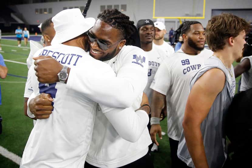 Dallas Cowboys quarterback Dak Prescott and linebacker Jaylon Smith congratulate one another...