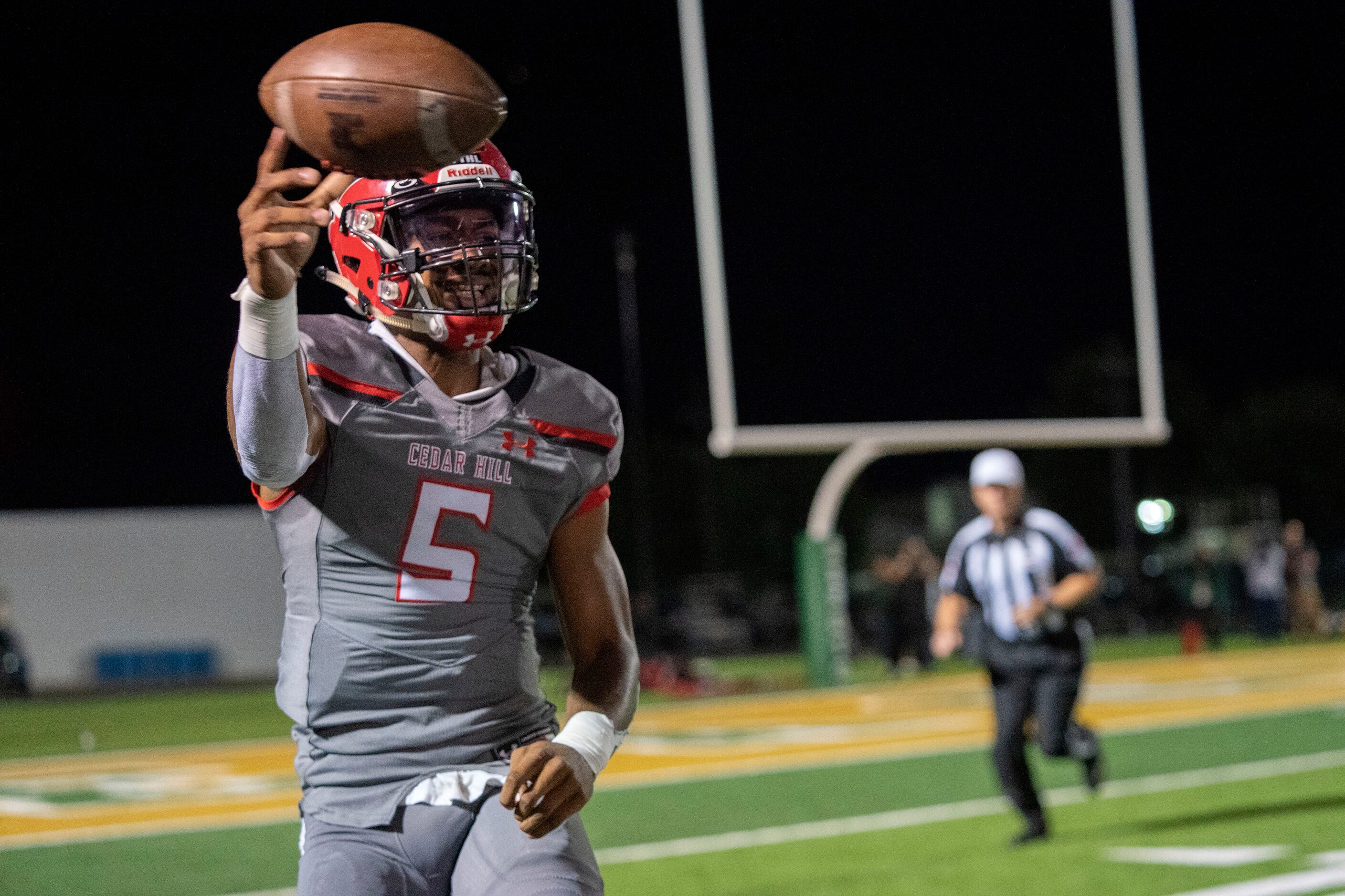 Cedar Hill junior quarterback Cedric Harden, Jr. (5) throws downfield during the first half...