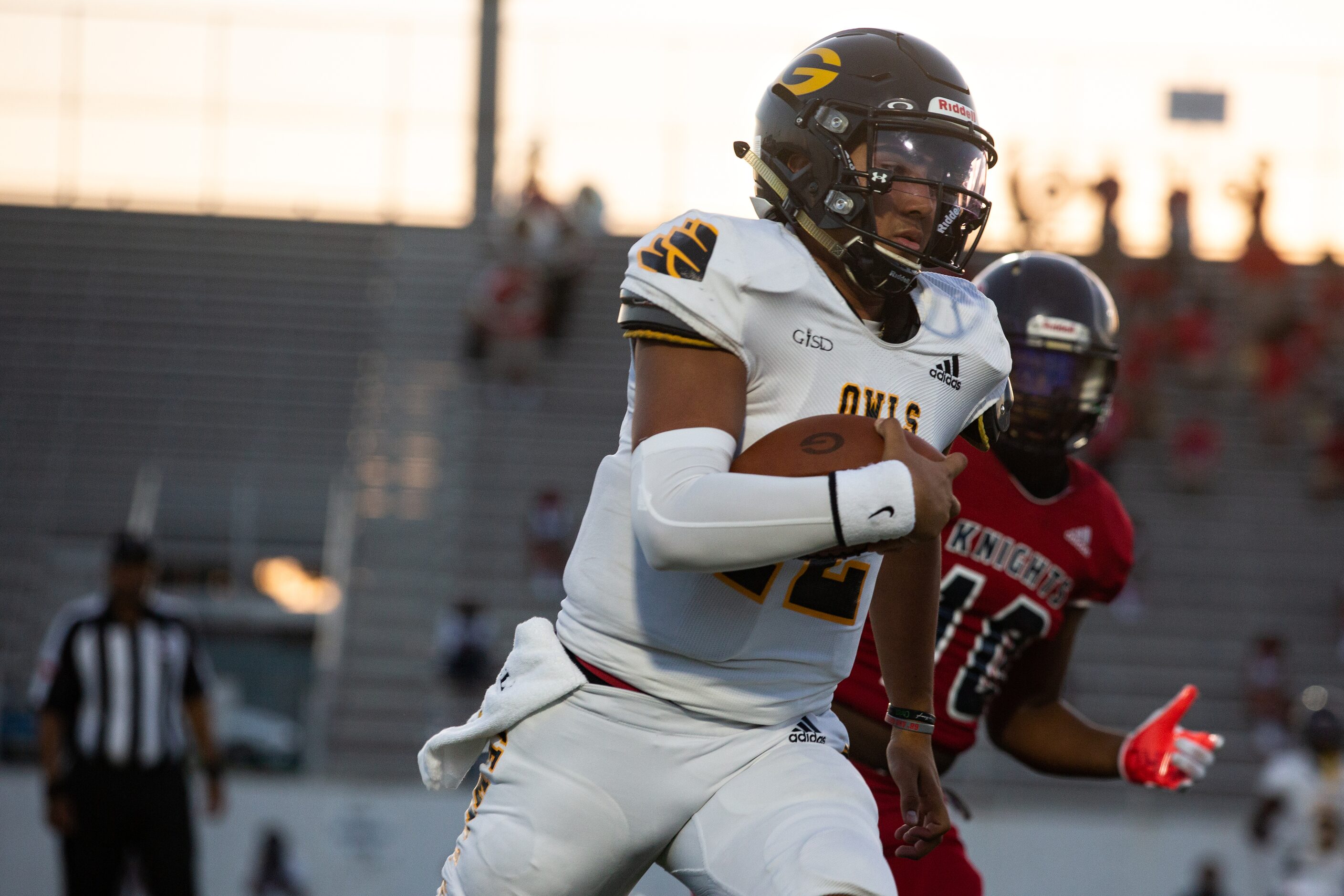 Garland High School quarterback Cergio Perez (12) runs the ball during their season-opening...