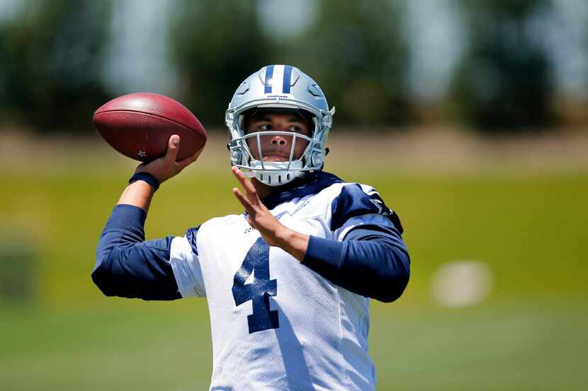 Dallas Cowboys quarterback Dak Prescott (4) throws during an end of organized team...