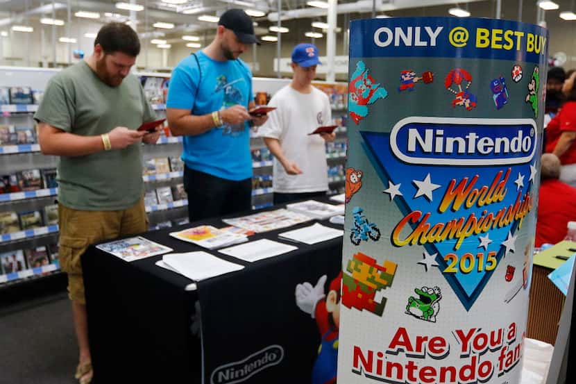 Competitors play Ultimate NES Remix during the Dallas qualifier for the Nintendo World...