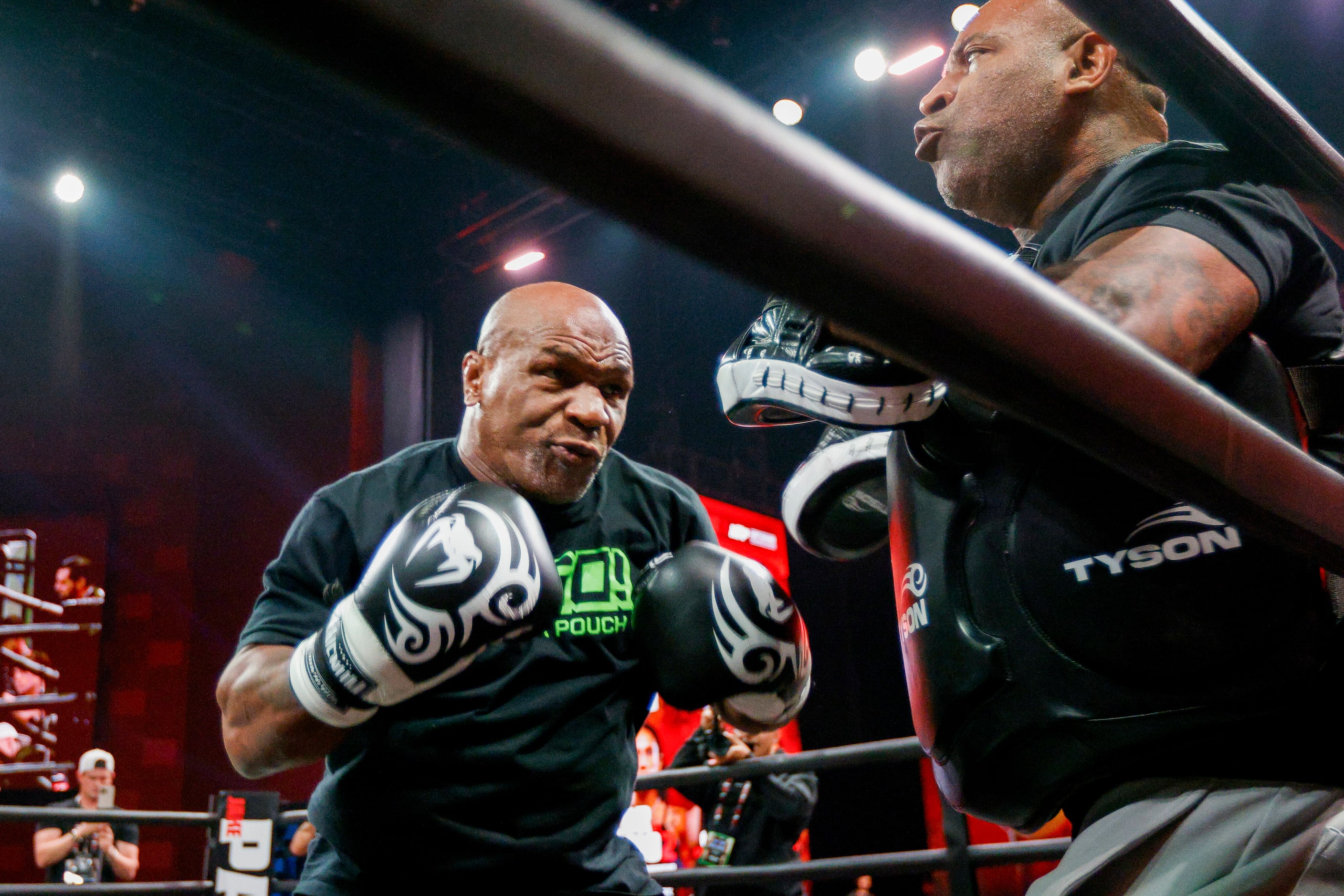 Mike Tyson spars in the ring during an open workout ahead of his upcoming boxing bout...