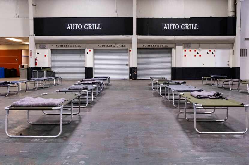 Cots were set up at the Automobile Building in Fair Park in February 2022 as a temporary...