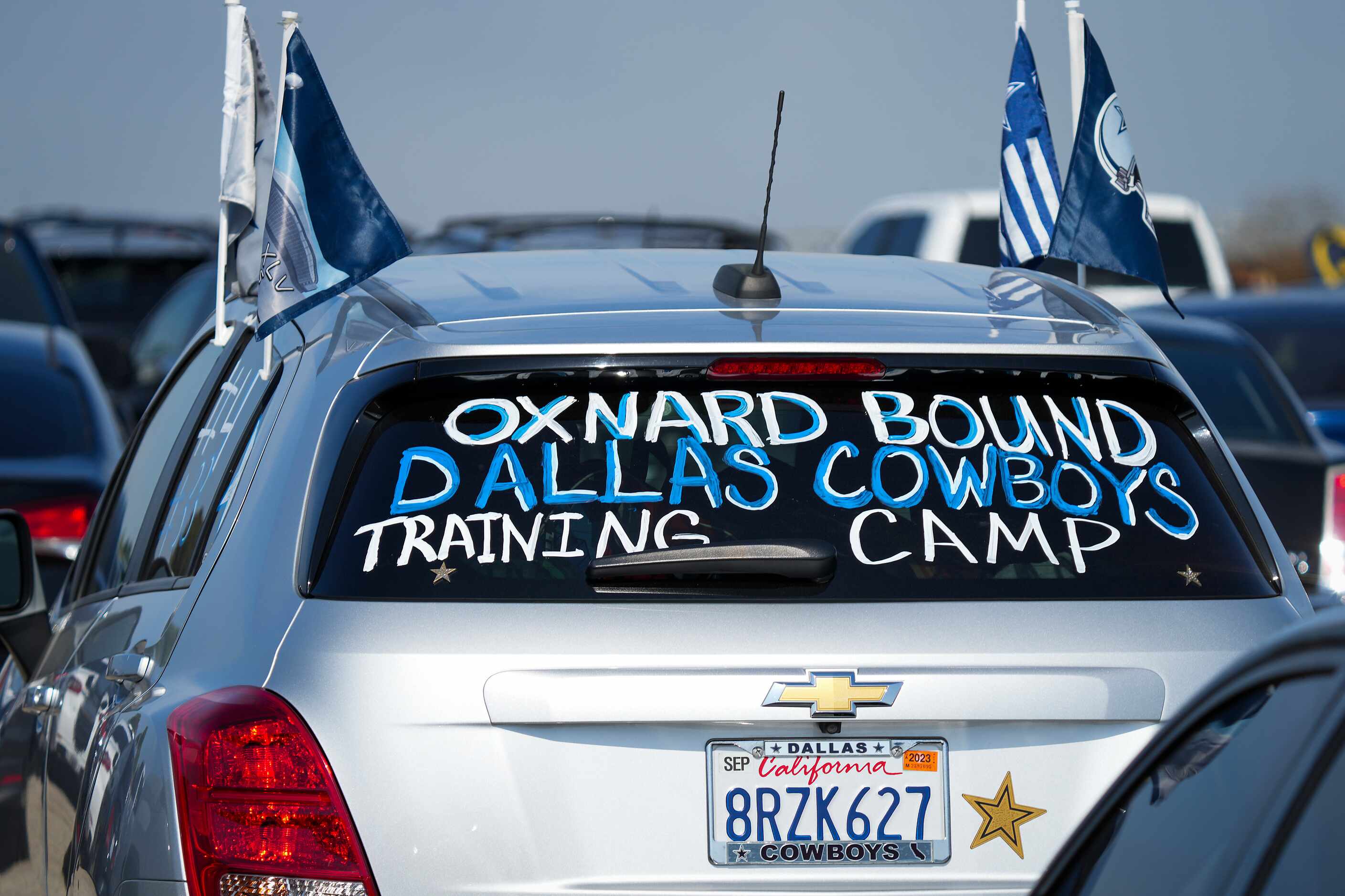 A car in the parking lot before opening ceremonies for Dallas Cowboys training camp on...