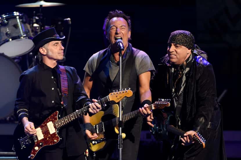 Bruce Springsteen, center, performs with Nils Lofgren, left, and Steven Van Zandt of the E...