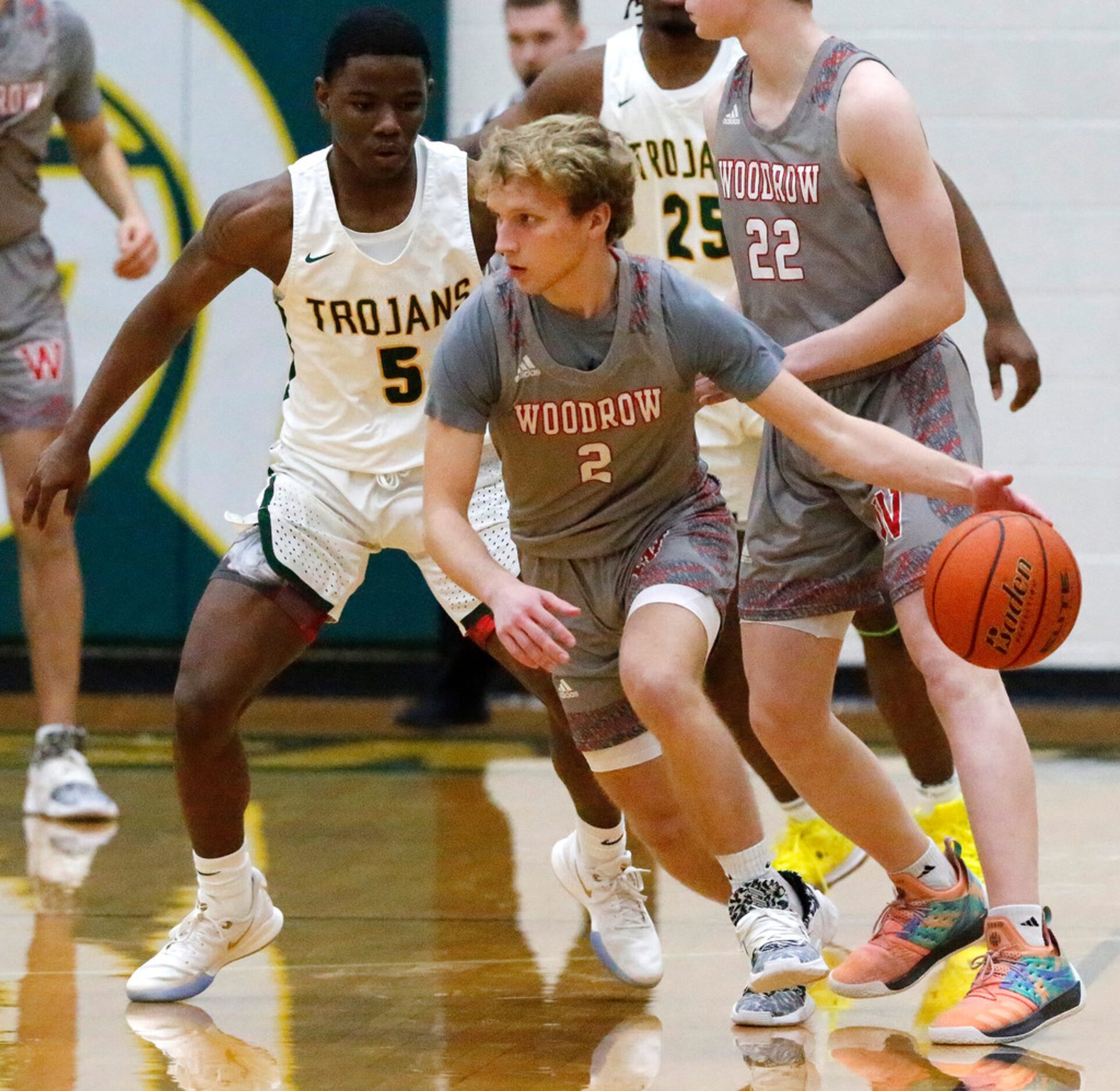 Woodrow Wilson High School Cade Ross (2) handles the basketball during the first half as...