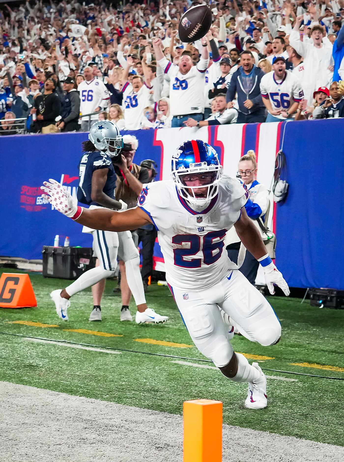 New York Giants running back Saquon Barkley (26) celebrates after scoring on a touchdown ...