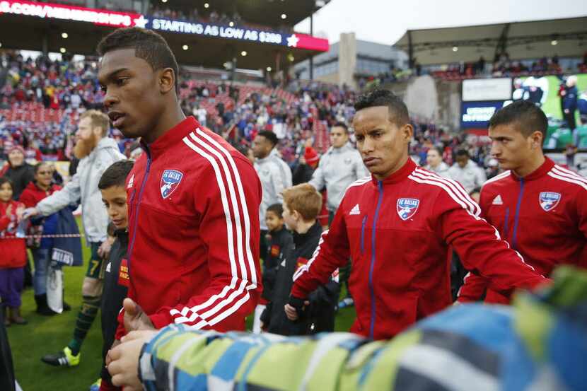 FC Dallas forward Fabian Castillo (11), front, walks out with teammates before the final leg...