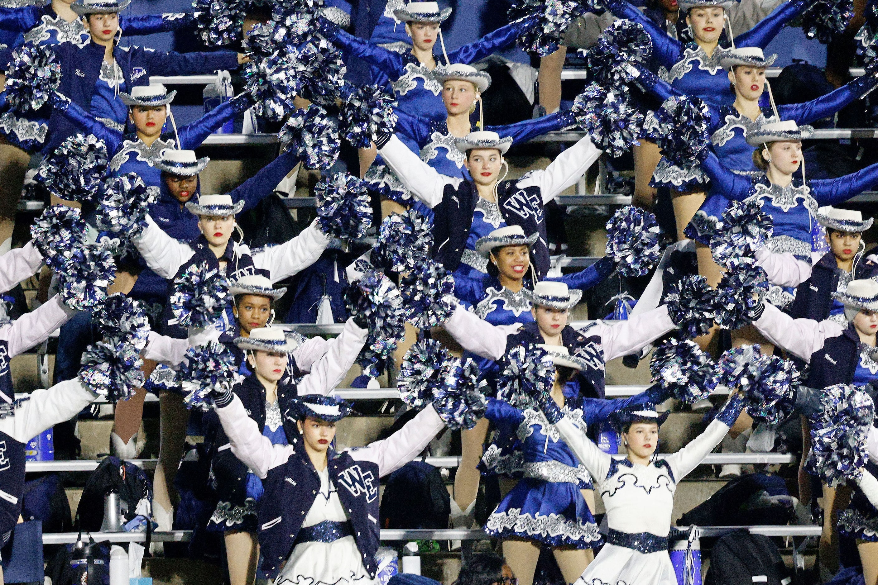 Wylie East dance team members perform in the first half of a high school football game...