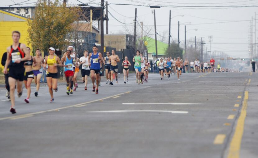 Runners head east on Singleton Blvd. near the third mile marker towards the Margaret Hunt...